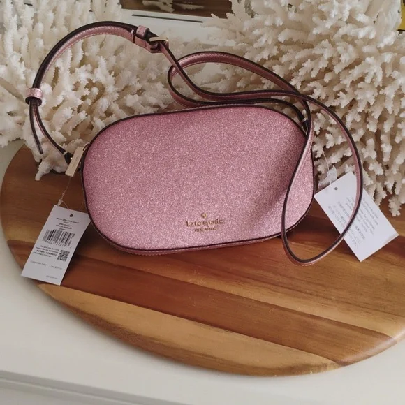 Kate Spade 💥NWT💥 Glimmer Oval Camera Bag Pink Mitten Crossbody Bag. NEW! - Picture 1 of 17